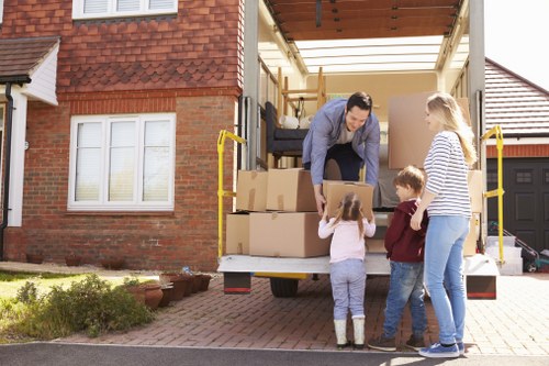 Students moving boxes during a removals service in Newsouthgate