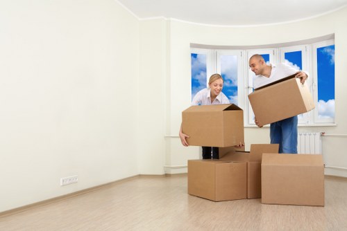 Packed moving boxes and household items ready for transport by Newsouthgate removalists