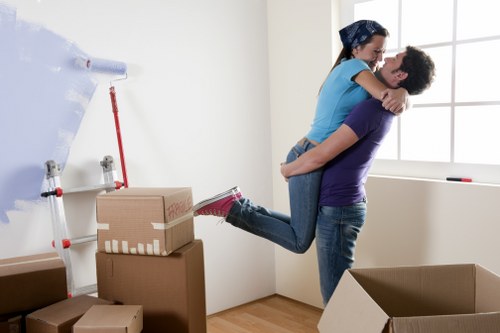 Local removal team handling furniture and boxes during a move in New Southgate