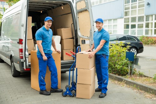Local moving team transporting boxes and household items
